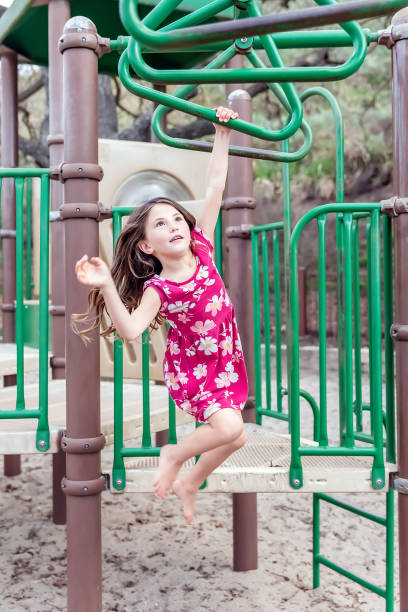 Young boy on playground merry go round