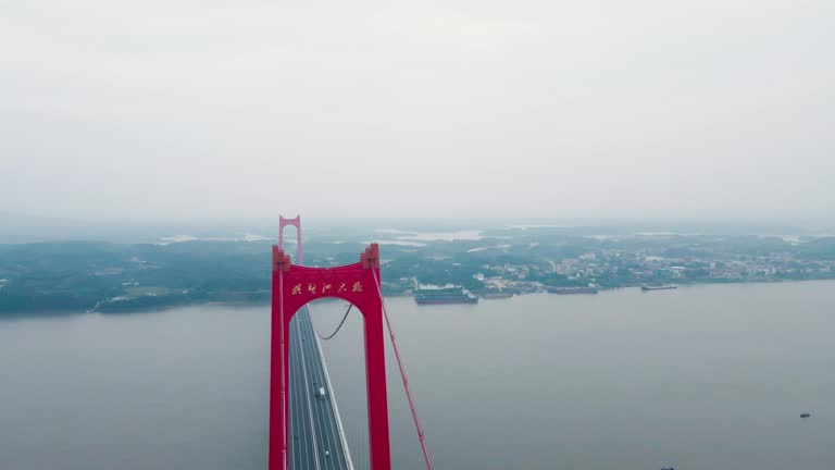 A cloudy cross river bridge