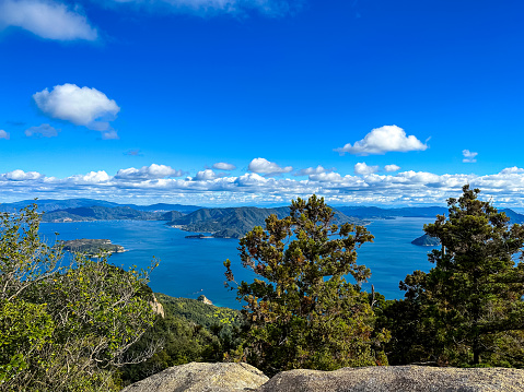 Miyajima, Itsukushima island, Japan - 13.11.2023. Mountain Misen observatory in Miyajima island, Hiroshima prefecture, Japan. Beautiful scenery from Mount Misen Observatory, Miyajima, Hiroshima, Japan. Sunny autumnal day.