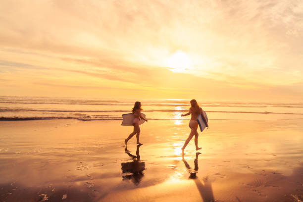 istock Beachside fun for everyone, being playful at beach with buggy boards. 2061618122