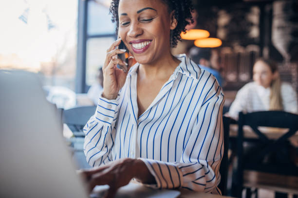 istock Businesswoman using laptop in cafe 2061631440