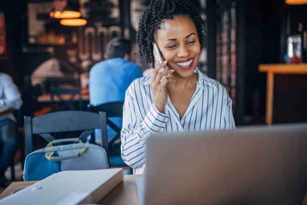 istock Businesswoman using laptop in cafe 2061632488