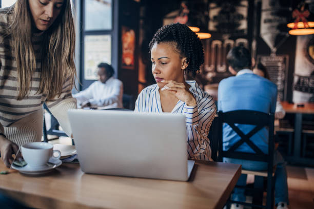 istock Businesswoman using laptop in cafe 2061639813
