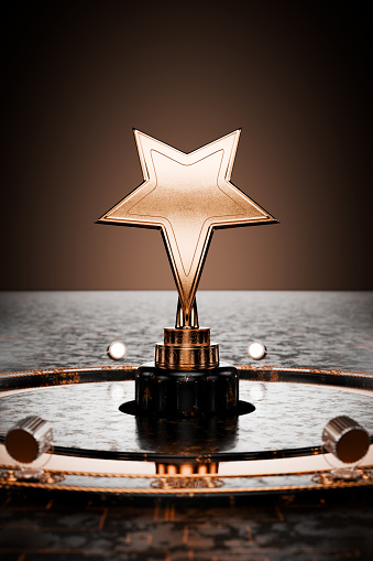 Star award. Prize, first place. Award on a metal background. Gold star on a pedestal, award template on a dark background. 3D rendering.