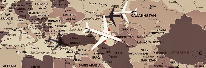 Model airplanes overlaid on a sepia-toned map of Eurasia, symbolizing the air traffic network.