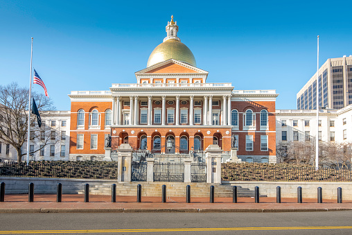 The Massachusetts State House, situated atop Beacon Hill in Boston, is a majestic symbol of the Commonwealth's rich history and governance. Completed in 1798, its iconic golden dome has become an emblem of the city. The State House serves as the seat of the Massachusetts government, housing both legislative chambers and the offices of the governor. Visitors are drawn not only to its architectural grandeur, featuring a neoclassical design by Charles Bulfinch, but also to its historical significance, with artifacts and paintings chronicling Massachusetts' pivotal role in American history.