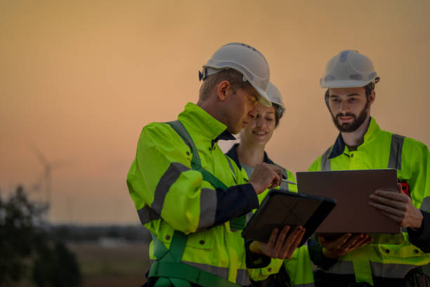 istock Team Engineers men and woman checking and inspecting on construction with sunset sky. people operation. Wind turbine for electrical of clean energy and environment. Industrial of sustainable. 2061726164