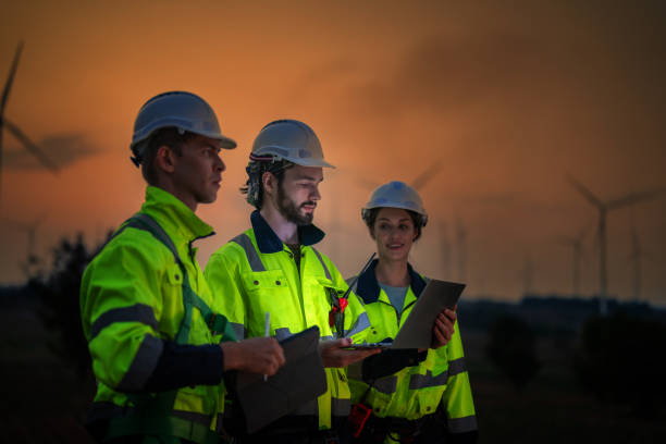 istock Team Engineers men and woman checking and inspecting on construction with sunset sky. people operation. Wind turbine for electrical of clean energy and environment. Industrial of sustainable. 2061728751