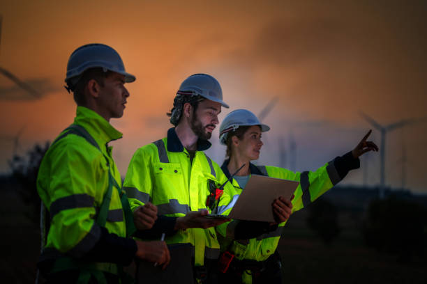 istock Team Engineers men and woman checking and inspecting on construction with sunset sky. people operation. Wind turbine for electrical of clean energy and environment. Industrial of sustainable. 2061735523