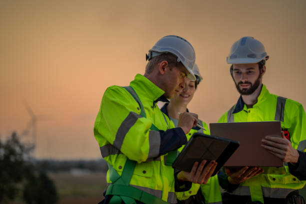 istock Team Engineers men and woman checking and inspecting on construction with sunset sky. people operation. Wind turbine for electrical of clean energy and environment. Industrial of sustainable. 2061738143