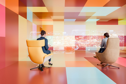 Two businesswomen working in futuristic office. 3D generated image.