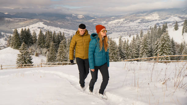 istock Young couple hike in winter snow 2061757370