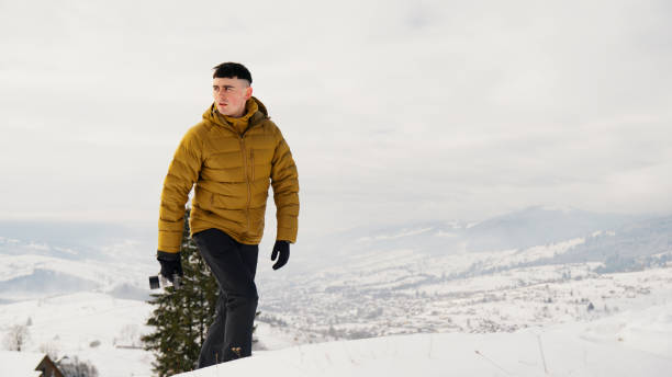 istock Young man photographer in winter 2061759993