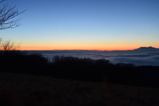Sunset, alpine mountain landscape. Scenic mountain view with colorful vibrant vibrant cloud sky, A sea of magic pink, purple and orange color gradient. Enjoying Beautiful view of, Summer on the mountain, Kopaonik