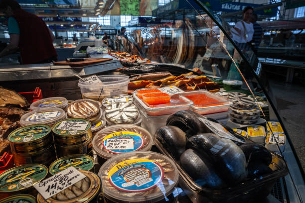 Picture of a stand selling smoked fish and other fish products at a fishmonger of centraltirgus in Riga, latvia. Riga Central Market is Europe's largest market and bazaar in Riga, Latvia.