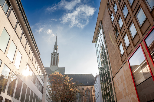 Street of Dortmund with the Propstein kirche, or Sankt Johannes Baptist Kirche church in the center of the city. Saint Johann Baptist church is a catholic church.