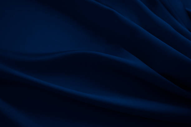 Black dark navy deep blue abstract luxury elegant premium background. Silk satin velvet fabric. Drapery fold line stripe wave flowing.