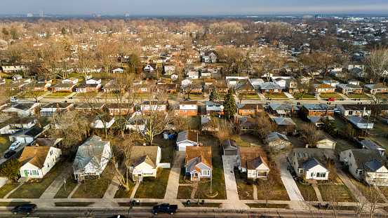 Royal Oak neighborhood in spring Michigan: small detached houses stretching along the suburban of Detroit