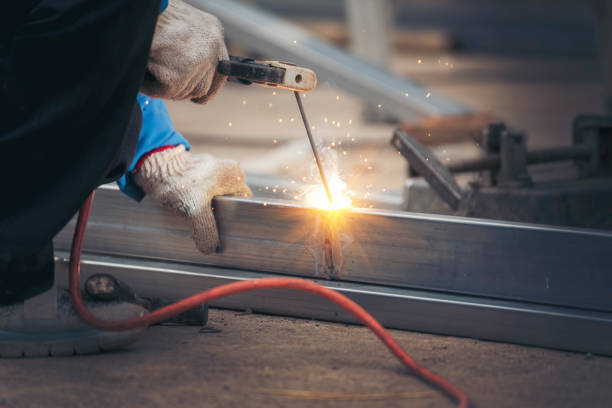 istock Men hands wear protective glove Hot flame metal work cutting fire iron workshop. Locksmith use Welding machine cut metal process. Construction Worker hands using Welding machinery iron metal sparking 2061903748