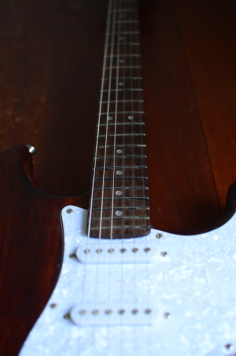 isolated image of the neck of the guitar