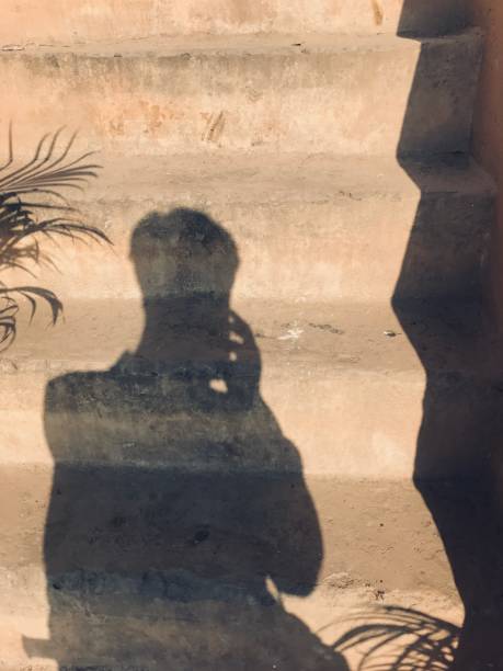 istock shadow of men on the steps stone 2062027282
