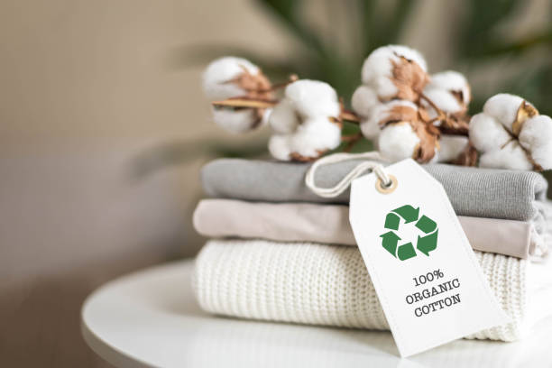 istock A neat stack of knitted clothing labeled 100% organic cotton. 2062043822