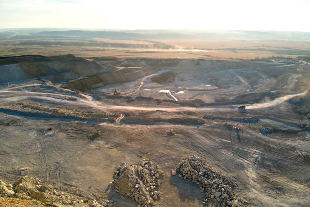 istock Aerial view of open pit mining site of limestone materials for construction industry with excavators and dump trucks 2062045401
