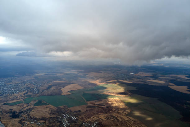 istock Aerial view from high altitude of earth covered with puffy rainy clouds forming before rainstorm 2062045403