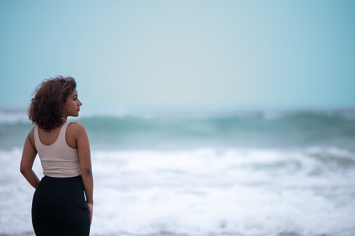 Woman seen standing at the beach