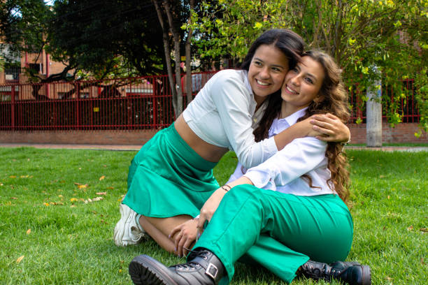 two beautiful young women having fun in a public park