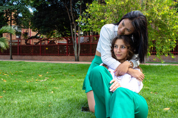 two beautiful young women having fun in a public park
