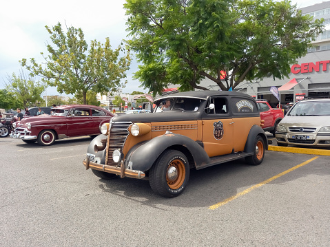 Buenos Aires, Argentina - Feb 25, 2024: Old brown 1938 Chevrolet Master delivery van at a classic car show in a parking lot. Copy space.