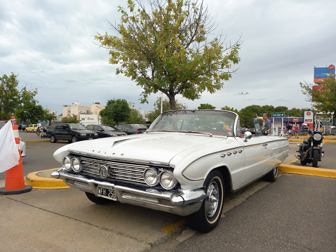 Buenos Aires, Argentina - Feb 25, 2024: old white 1961 Buick Electra convertible at a classic car show in a parking lot. Copy space