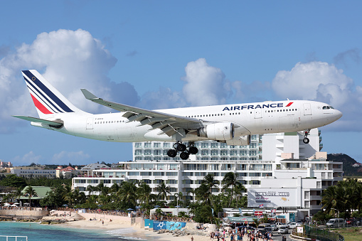 Airplane flying over Maho Bay Beach, Sint Maarten