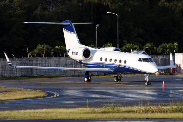 a Gulfstream private jet sits parked on the airport apron on a business visit