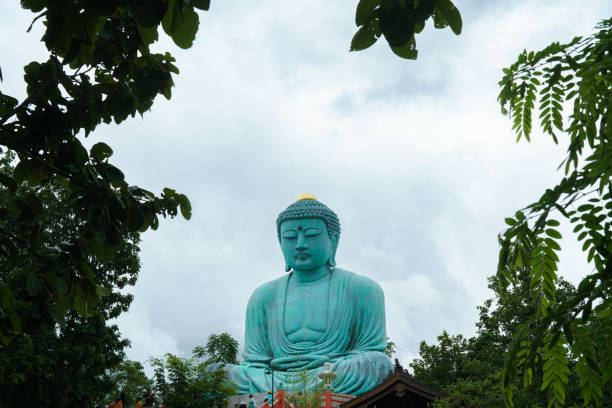 Free Stock Photo of Buddha Statue Surrounded by Green Leaves | Download ...