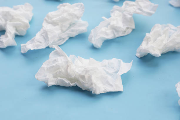 istock Crumpled tissue paper. Facial tissue on blue background. 2062236795