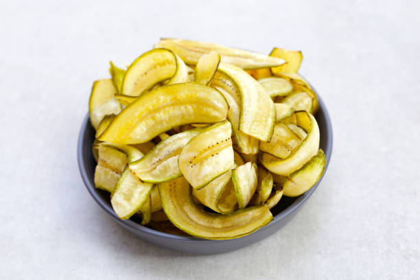 istock Banana chips, fried slices banana with green peel 2062236906