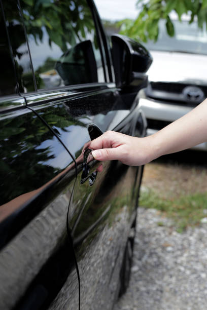 istock Male hand opening car door 2062236991