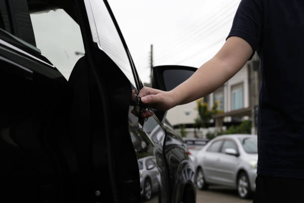 istock Male hand opening car door 2062245306