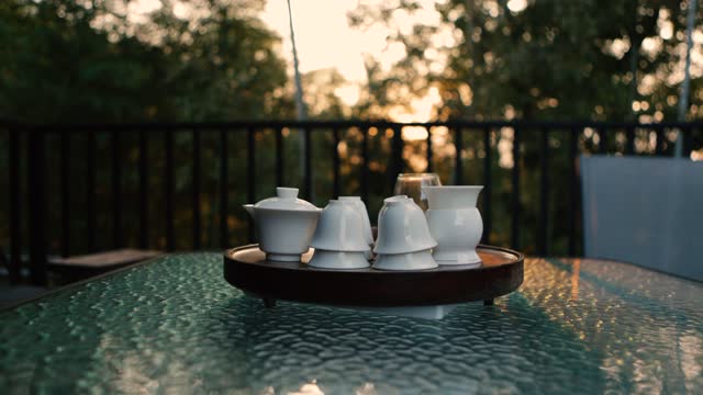 Tea cups under the sunset