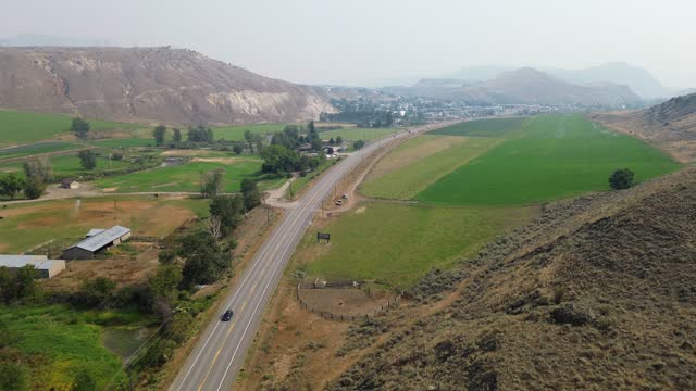 Aerial Views Over Cariboo Highway near Desert Hills Ranch Farm Market and Cache Creek in British Columbia, Canada.