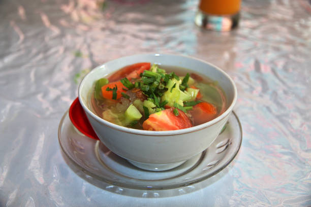 Three bowls filled with chili, chicken noodle soup and navy bean soup.