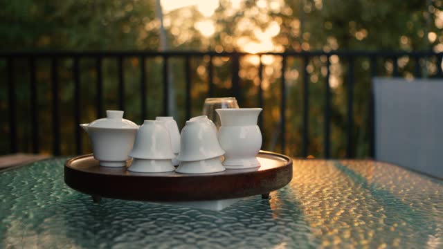 Tea cups under the sunset