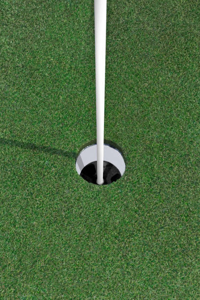 istock Vertical color photo looking into an empty golf hole on green golf course lawn. 2062384508