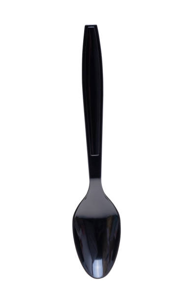 plastic spoon isolated stock photo