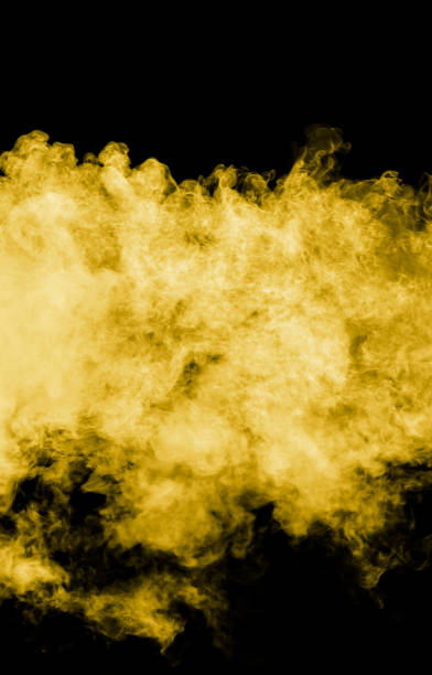 istock Yellow smoke isolated black background 2062399508