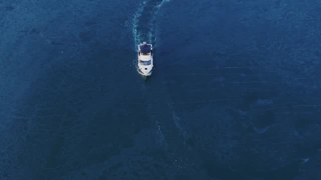 Yachting On Frozen Water During Winter In Tacoma, Washington, USA. aerial static shot