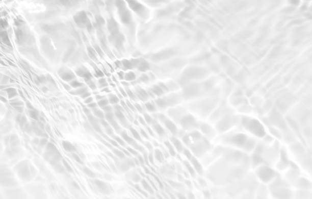 istock White water surface texture with ripples, splashes, and bubbles. Abstract summer banner background Water waves in sunlight with copy space cosmetic moisturizer micellar toner emulsion. White water. 2062427558