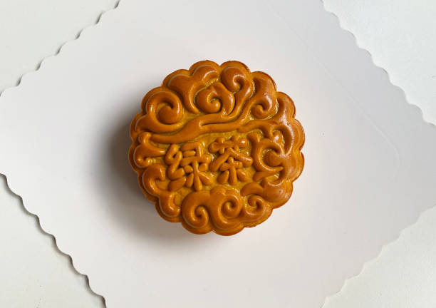 istock traditional gourmet home made baked moon cake mixed nuts lotus paste egg yolk red bean filling on white background for Chinese mid autumn festival celebration dessert pastry menu halal food in asian 2062429187